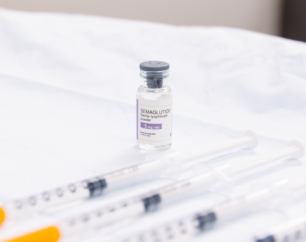 Bottle of semaglutide, a weight management treatment that can also improve heart health, helping men prevent the need of visiting a cardiologist in Jacksonville, NC