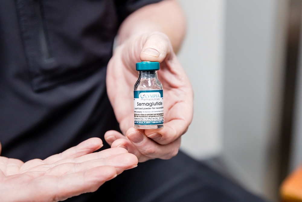 A provider holding a vial of Semaglutide near Swansboro, NC.